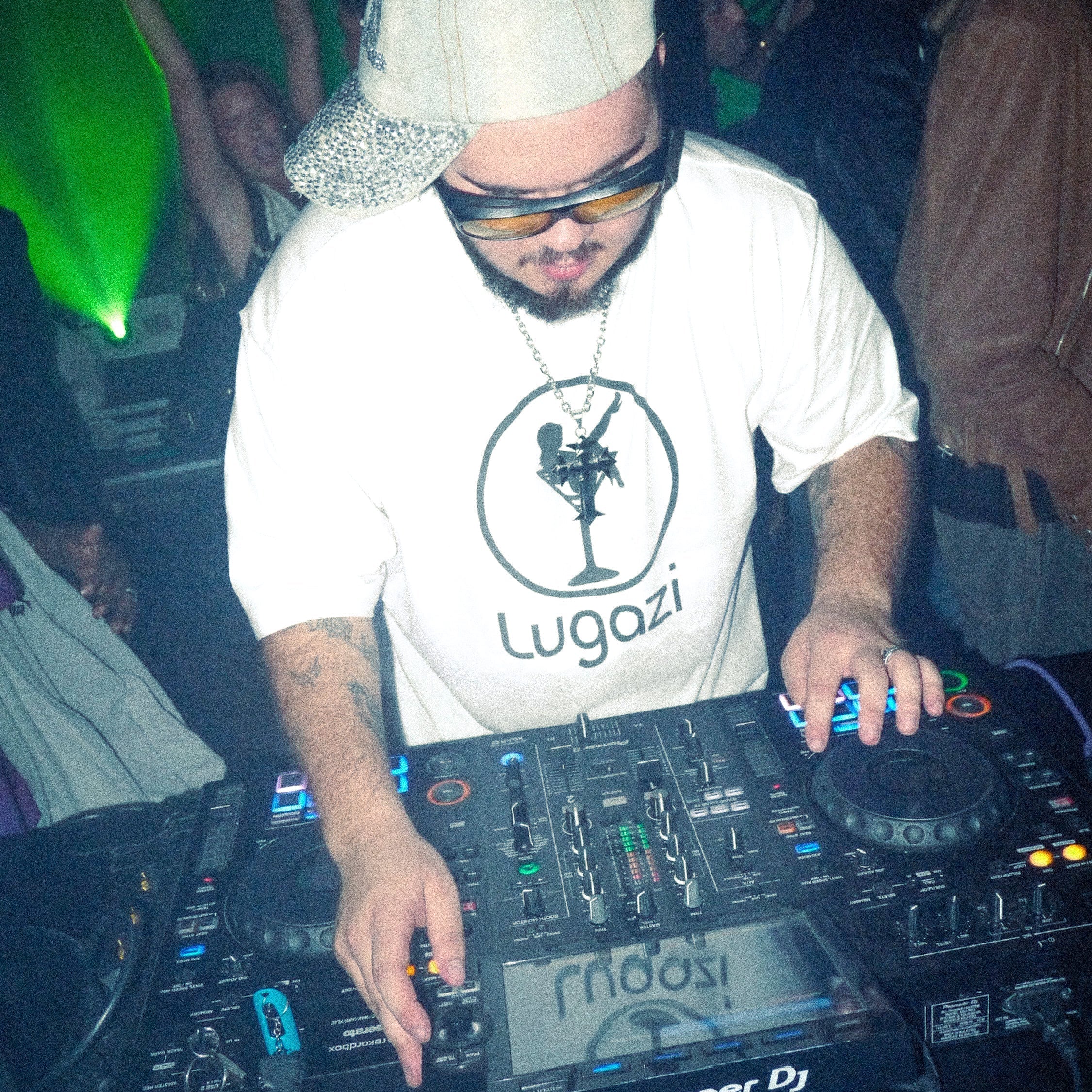 DJ performing at a vibrant Lugazi event, showcasing club culture, art and community by Leandro Carrere.